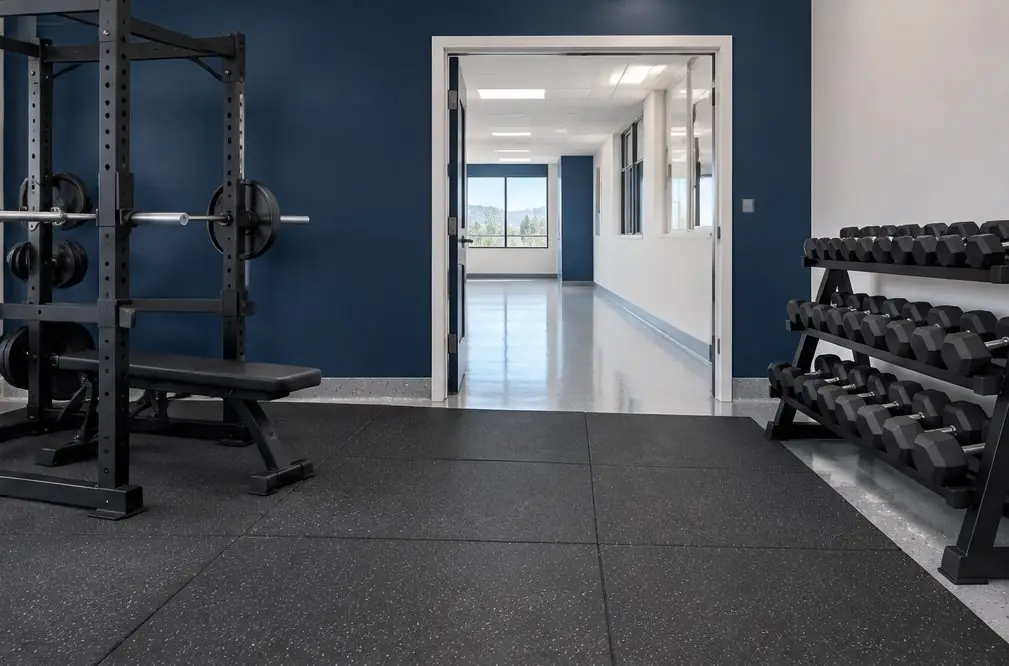 Illustration: a fitness studio in a retail unit with a charcoal and white flake epoxy floor, painted training zone lines, free weights on a rack and a mirrored wall